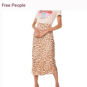 Free people skirt, normani, camel combo print. Size 8